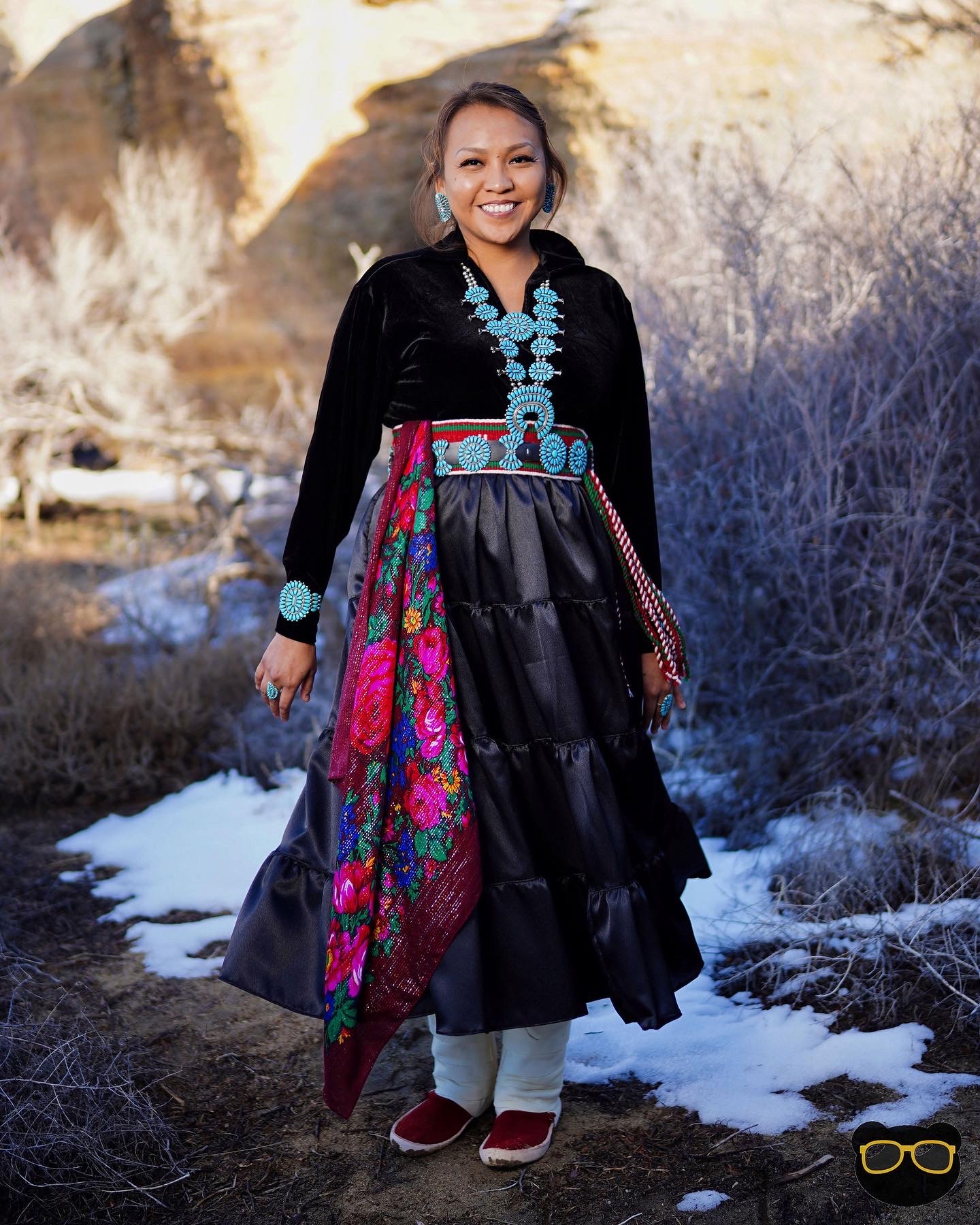 Jones standing and smiling at photographer