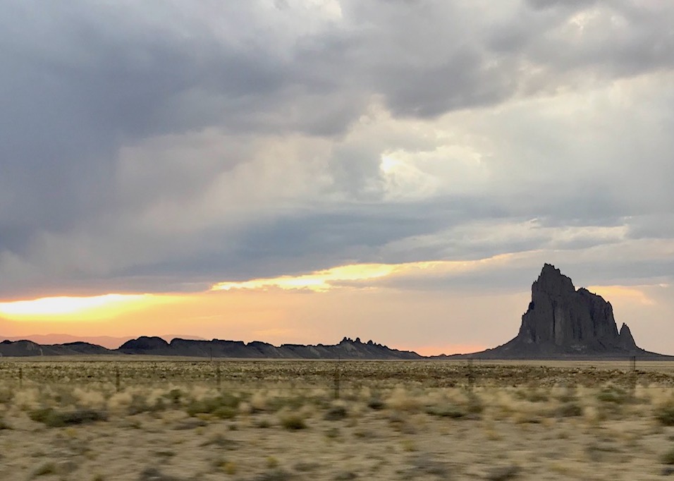 Northern Arizona plains with rocky formation in background