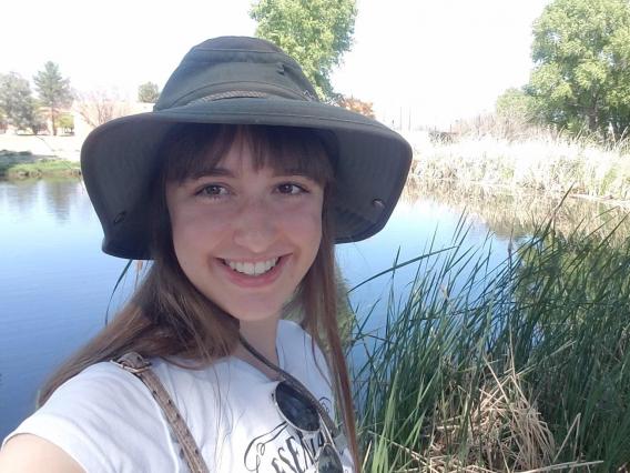 Sandy Slovikosky in front of pond