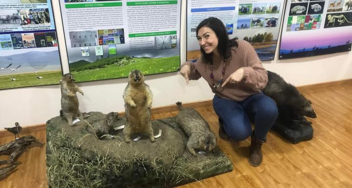 Mazzamuto poses next to taxidermied Tarbagan marmots 